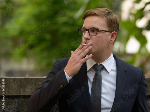 Businessman with blond hair in the streets outdoors