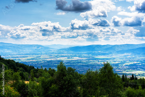 Fototapeta Naklejka Na Ścianę i Meble -  Panoramic view of Bielsko Biala city from the slopes of Magurka in Beskid Maly, Poland. Bielsko is a city located at the foot of the mountains with good tourist infrastructure.