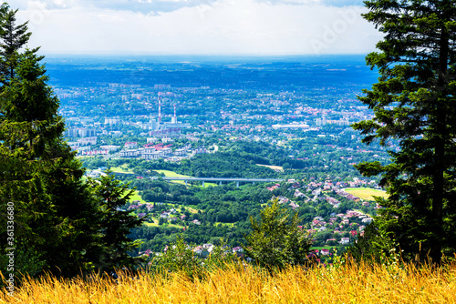 Fototapeta Naklejka Na Ścianę i Meble -  Panoramic view of Bielsko Biala city from the slopes of Magurka in Beskid Maly, Poland. Bielsko is a city located at the foot of the mountains with good tourist infrastructure.