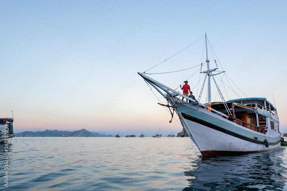 June 14, 2018 - Labuan Bajo : A person standing on the fore of a boat overlooking the sea around Komodo National Park June 14, 2018 - Labuan Bajo : A person standing on the fore of a boat overlooking the sea around Komodo National Park