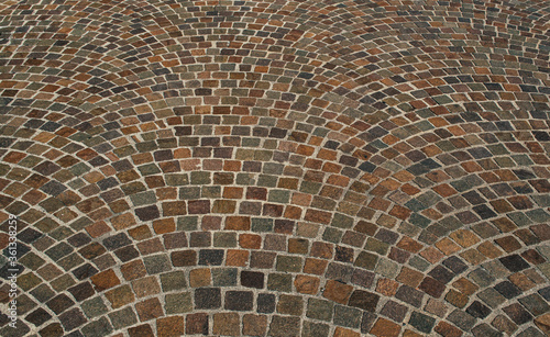 Road surface in the form of colored pavers.