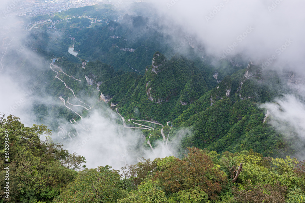 China's misty winding mountain road, the beautiful Zhangjiajie natural scenery.