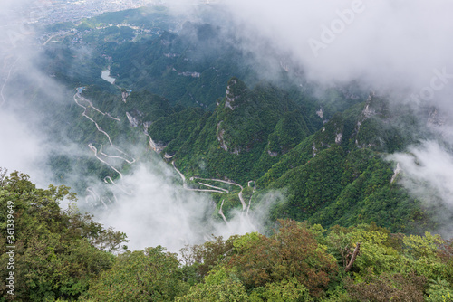 China's misty winding mountain road, the beautiful Zhangjiajie natural scenery.