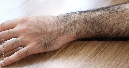 Hairy man arm close up view photo