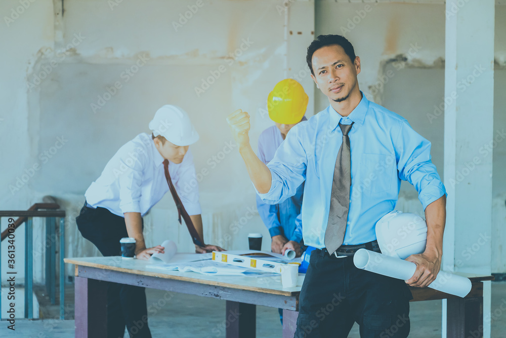Portrait of handsome engineer with construction site background. Portrait of handsome engineer with construction site background.