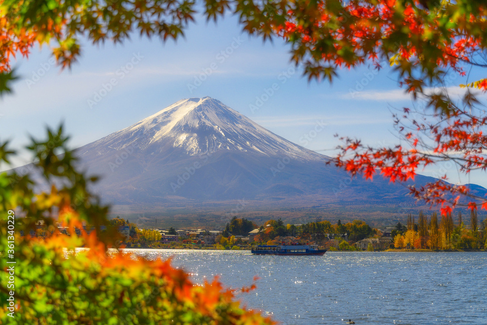 beautiful view of Fuji san mountain with white cloud and blue sky wtih travel boat,winter morning fog in autumn season at lake Kawaguchiko, best places in Japan, travel and landscape nature concept