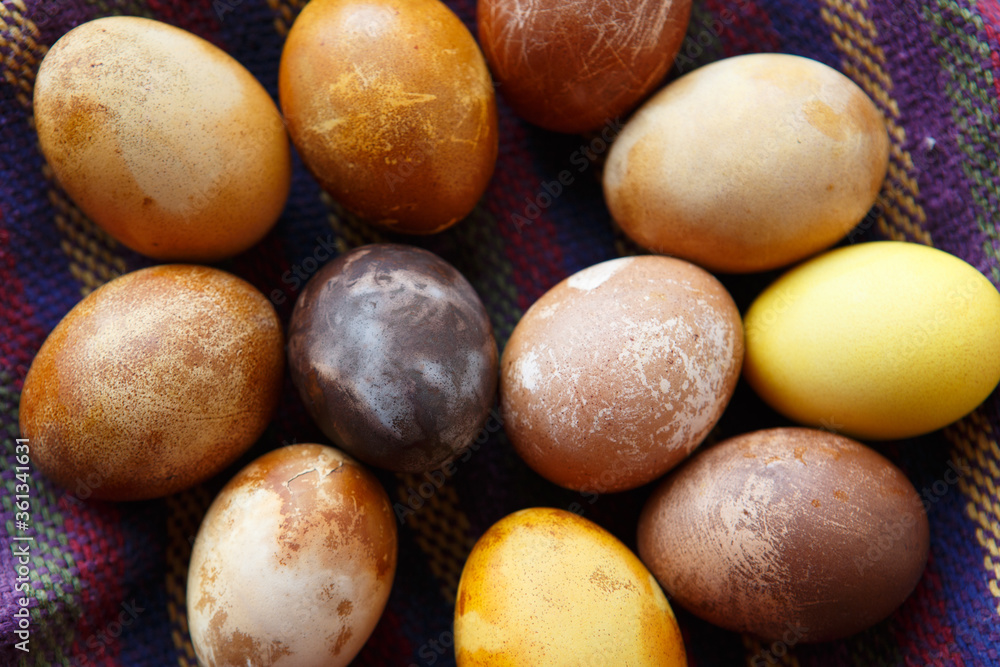 filled frame background wallpaper shot of a bunch of original colorful dragon or dinosaur looking like chicken Easter eggs, dyed with natural products (red wine, tea, coffee, carrots, turmeric) filled frame background wallpaper shot of a bunch of original colorful dragon or dinosaur looking like chicken Easter eggs, dyed with natural products (red wine, tea, coffee, carrots, turmeric)