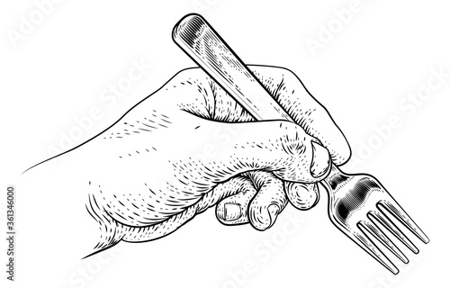 A hand holding a fork for eating food in a vintage retro engraved or etched woodcut print style