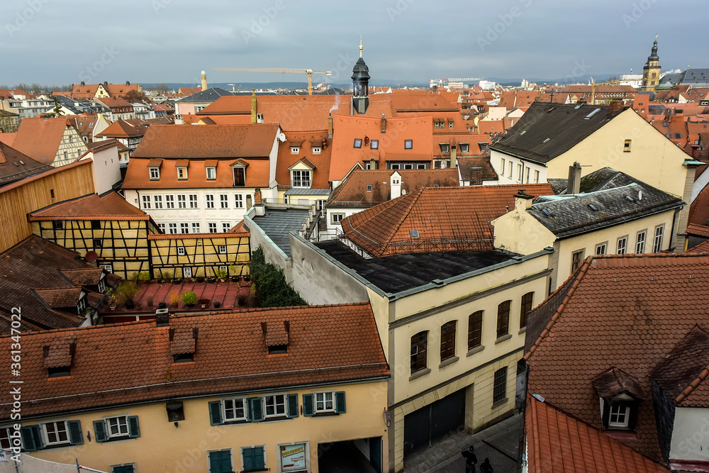View of traditional houses with typical red tiled rooftops in Bamberg, Bavaria, Franconia, Germany. November 2014