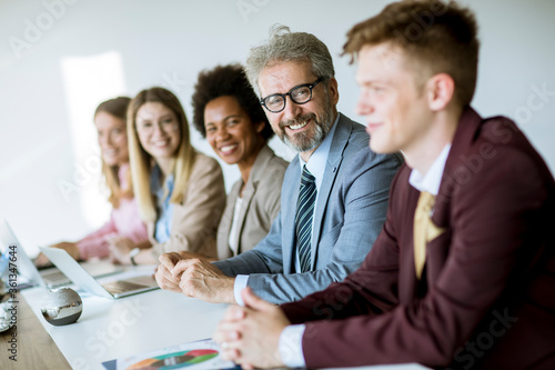 Group of young multiethnic business people working on new project