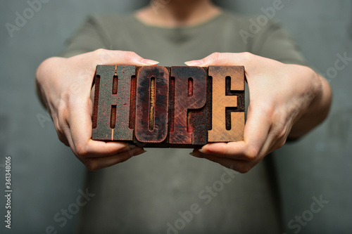 Woman holding the word 