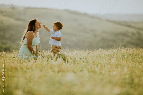 Young pregnant mother with ...