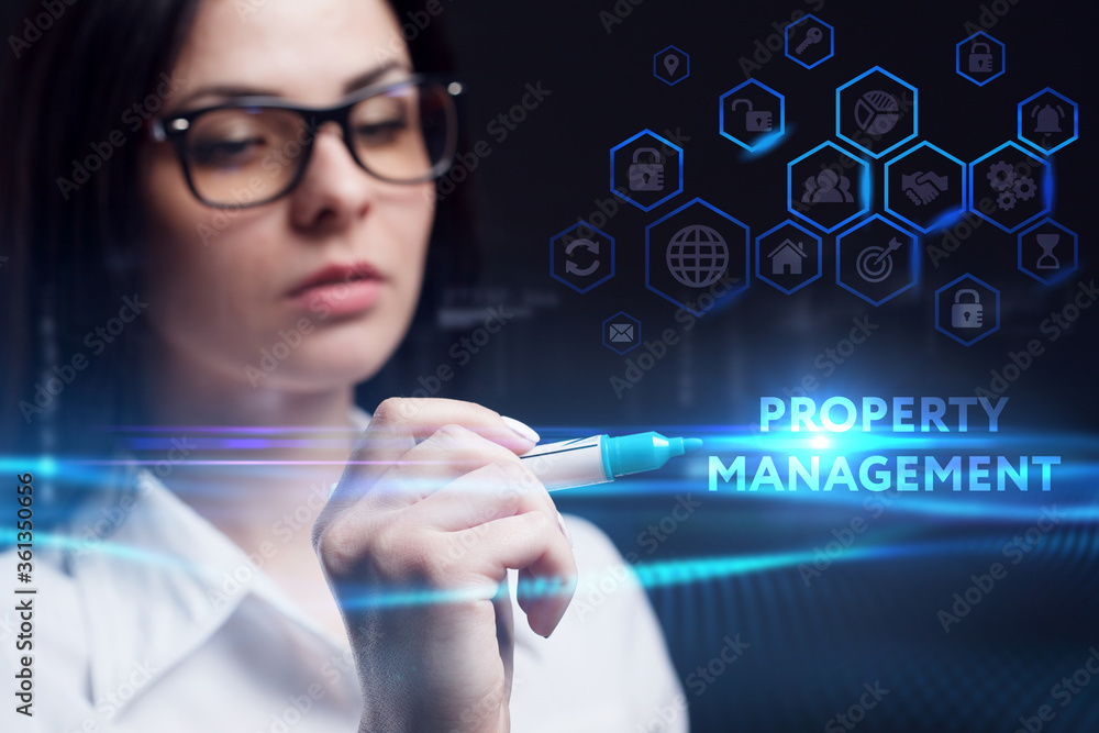 Business, Technology, Internet and network concept. Young businessman working on a virtual screen of the future and sees the inscription: Property management