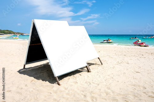 Fototapeta Naklejka Na Ścianę i Meble -  Blank billboard advertisement mock up banner on the beach. Clipping path include in this image.