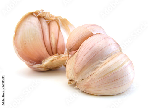 Stack garlic and mint on white background