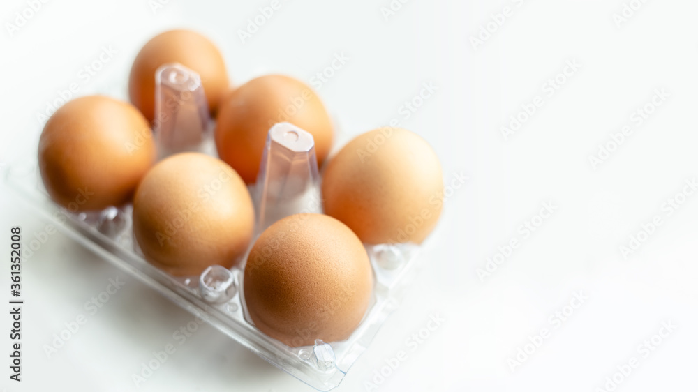 tray with chicken eggs on a light background, copy space tray with chicken eggs on a light background, copy space