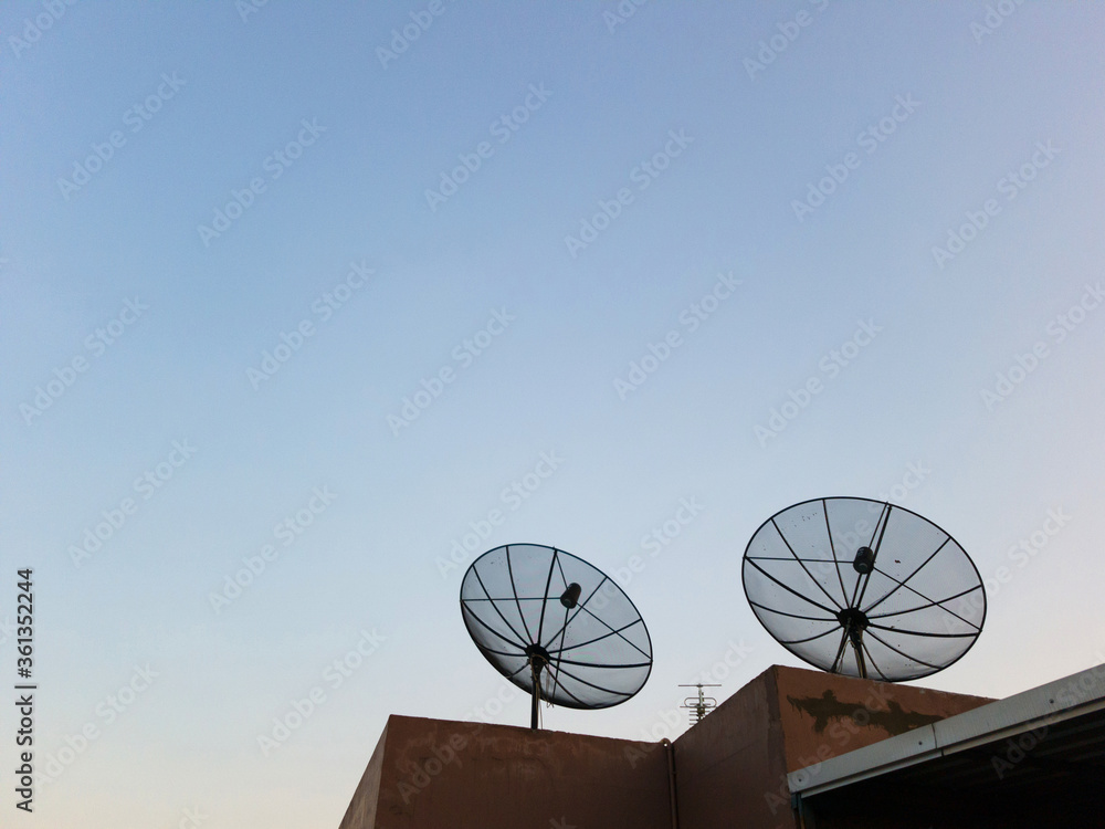 Two Antenna communication satellite dish on top of the building