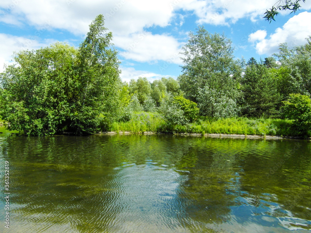 Beautiful summer landscape by the water surface on a Sunny summer day Beautiful summer landscape by the water surface on a Sunny summer day