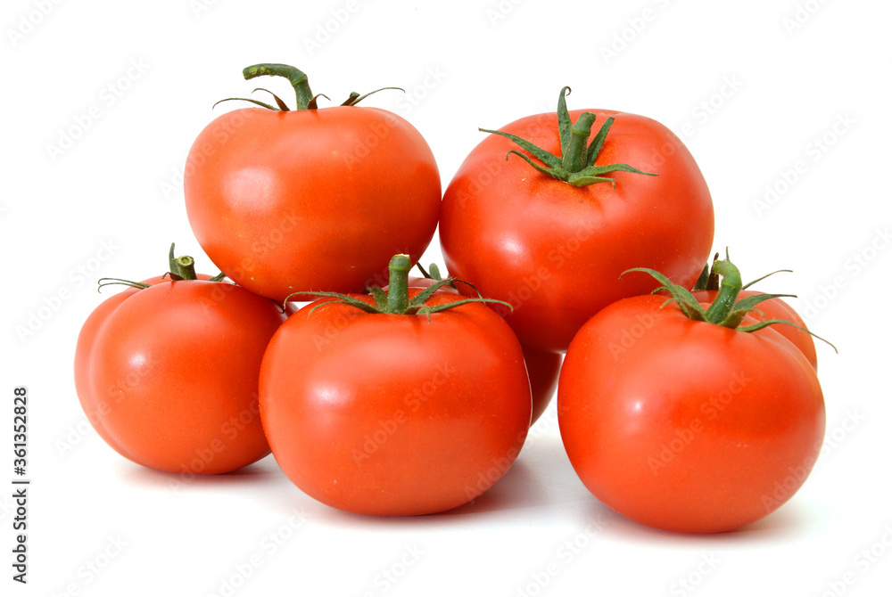 Closeup of tomatoes on the vine isolated on white