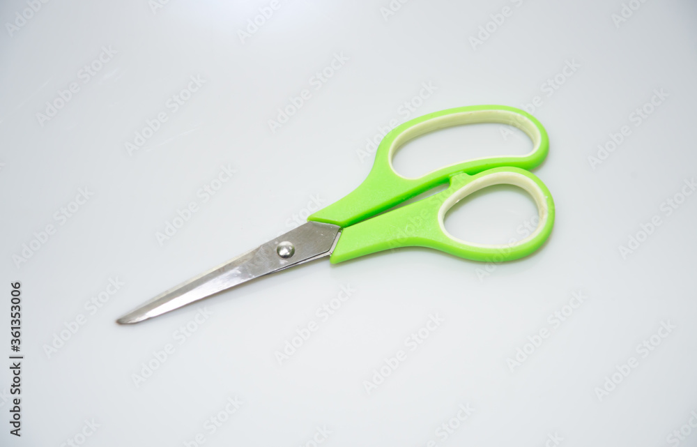 scissors on a green background scissors on a green background