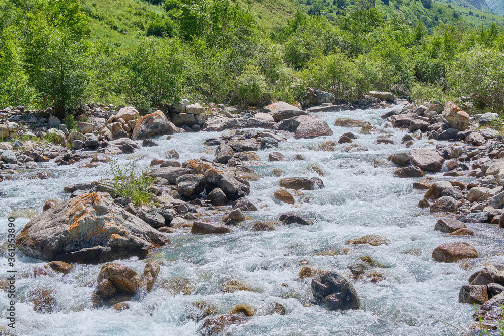 mountain river goes around stones mountain river goes around stones