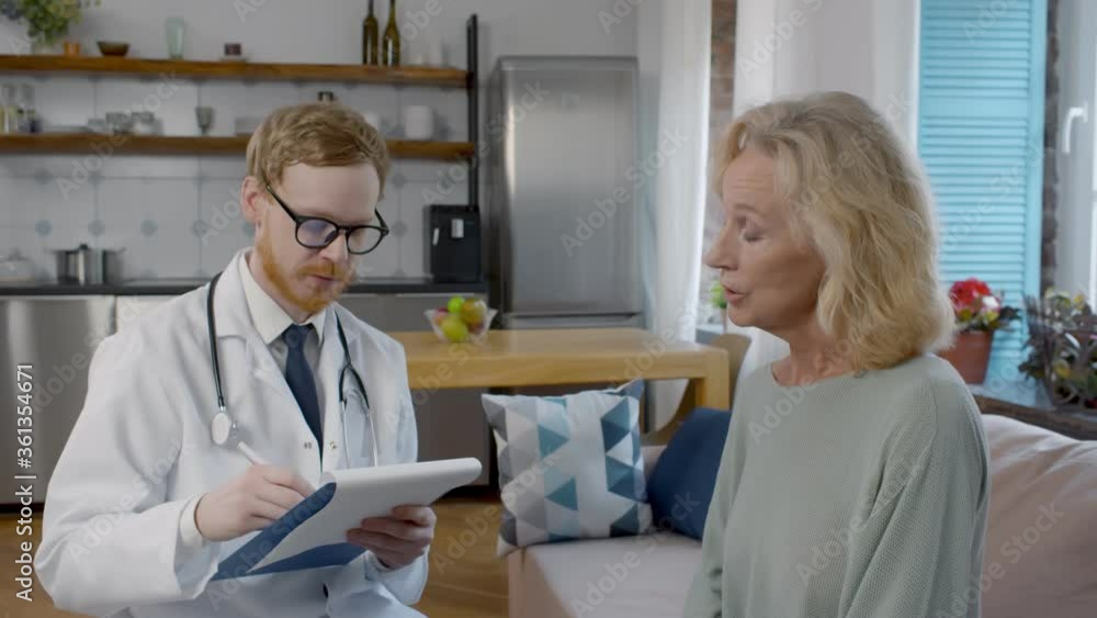 Young doctor visiting old mature woman for check-up Young doctor visiting old mature woman for check-up
