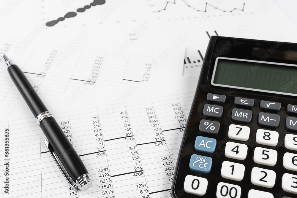 bookkeeping and accounting business concept, calculator and pen on data sheets and printed charts bookkeeping and accounting business concept, calculator and pen on data sheets and printed charts