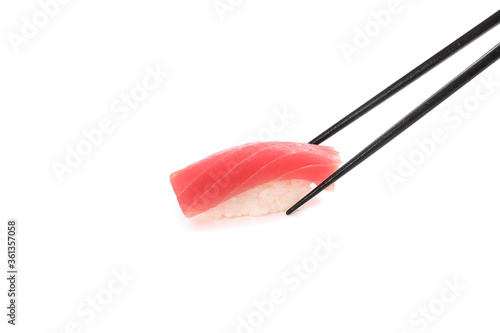 Tuna sushi with chopsticks , Japanese food isolated in white background