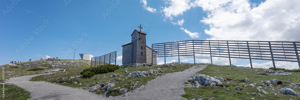 Panoramic image. Wooden Church on Krippenstein of the Dachstein Mountains range. Austria