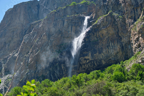 high in the mountains waterfall on the rocks