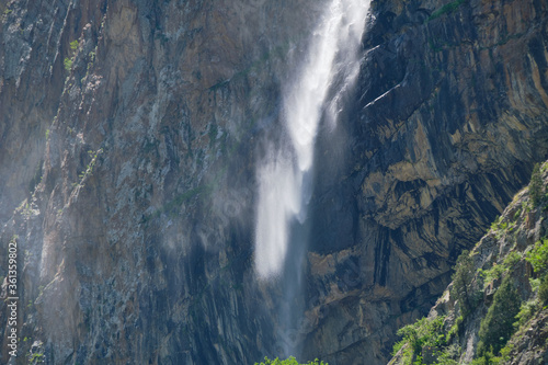 high in the mountains waterfall on the rocks