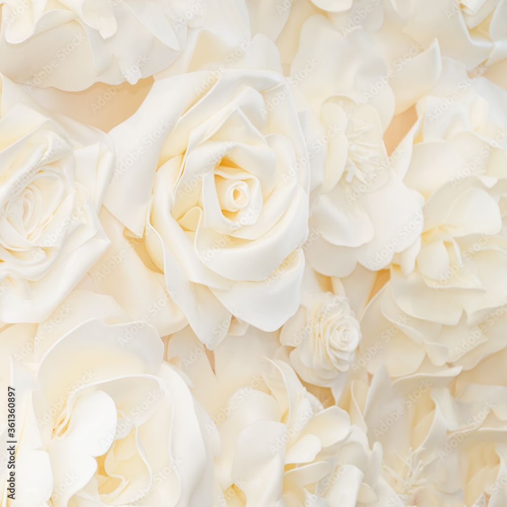 Artificial white rose buds for background and design. White floral background Artificial white rose buds for background and design. White floral background
