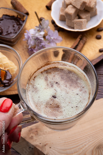 Wallpaper Mural cup of coffee with sweets for coffee served at wooden tray at black wooden table. close up Torontodigital.ca