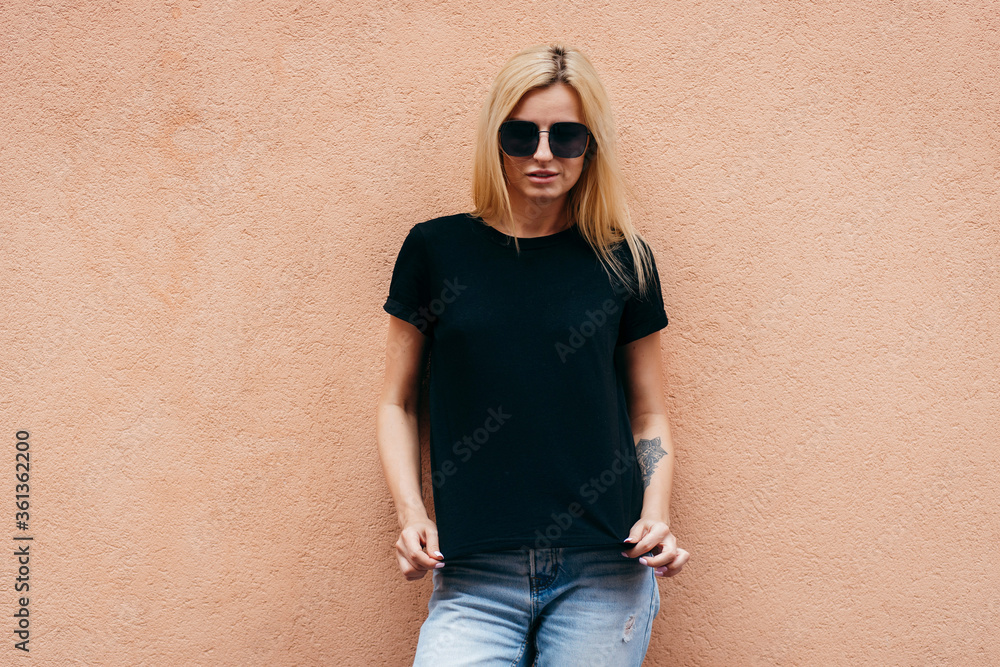 © andrew_shots - Stylish blonde girl wearing black t-shirt and glasses posing against street , urban clothing style. Street photography © andrew_shots - Stylish blonde girl wearing black t-shirt and glasses posing against street , urban clothing style. Street photography