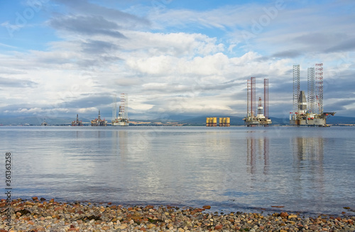 Stacked oil rigs viewed from the village of Cromarty in the Cromarty Firth Scotland photo