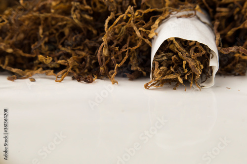 Wallpaper Mural macro photo of hand rolled tobacco in its leaves. there is space in the photo for text.	 Torontodigital.ca