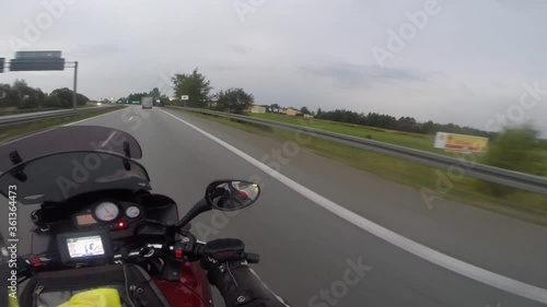 A motorcyclist moves on a European highway in a first-person view. Poland, Europe, September 2018