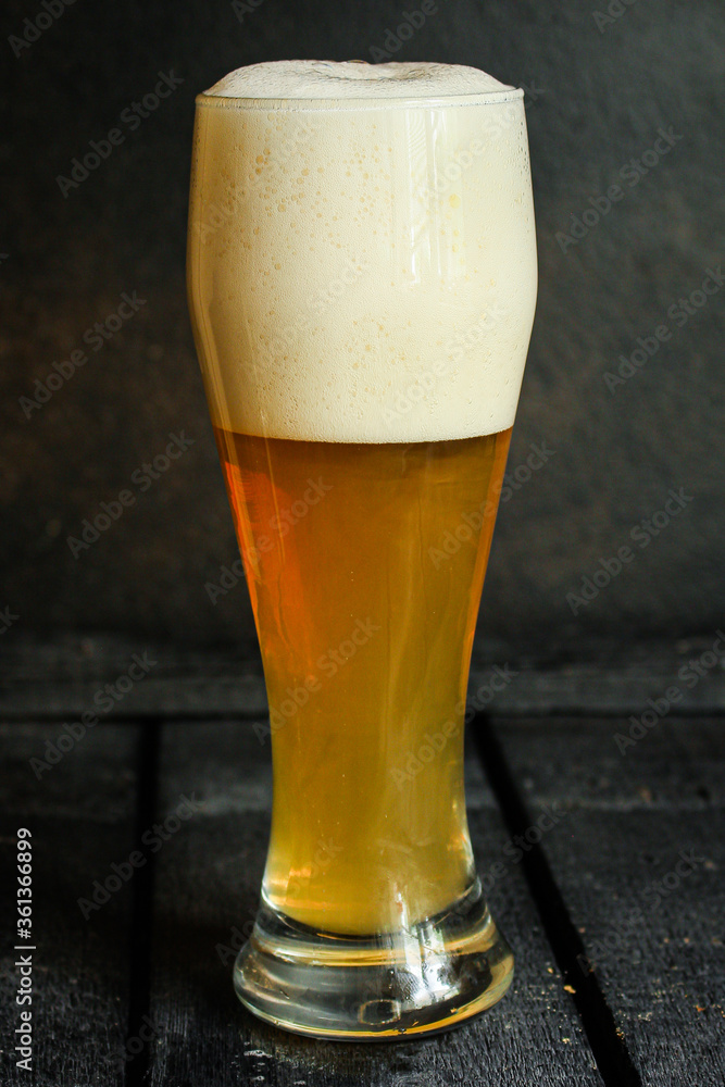 beer light unfiltered cold drink with foam Menu concept serving size. food background top view copy space for text organic