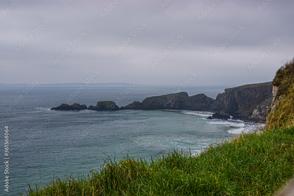 Photo of the beach in Belfast during winter and a cloudy day in the Giants Causeway Photo of the beach in Belfast during winter and a cloudy day in the Giants Causeway