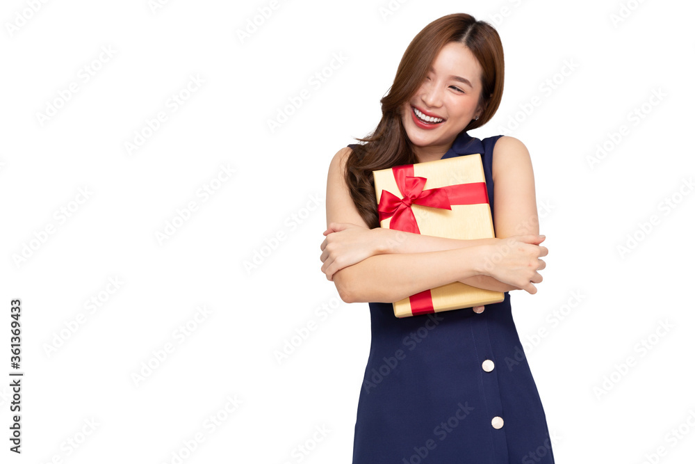 Young Asian woman hugging gold gift box isolated over white background Young Asian woman hugging gold gift box isolated over white background