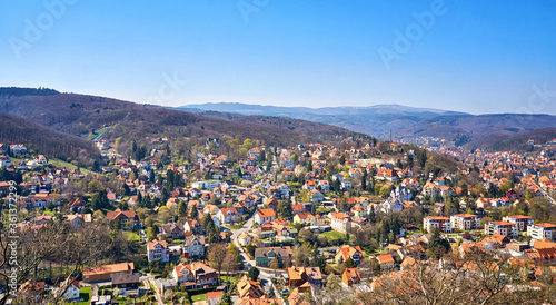 City panorama with beautiful houses in Wernigerode with the Harz Mountains in the background. Saxony-Anhalt, Germany