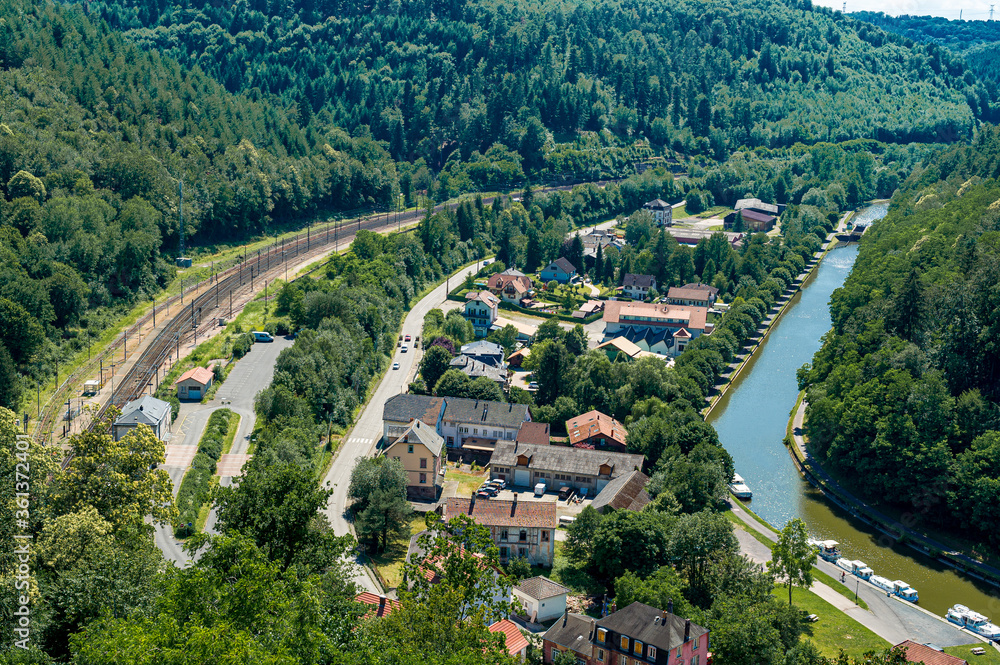 Panoramic view of the Zorn valley, village of Lutzelbourg. In this narrow valley, the river, the canal, the national road and the railway pass by.