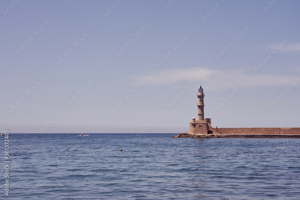 The lighthouse of Chania on Crete, Greece against a foggy horizon over the sea. Copy space.