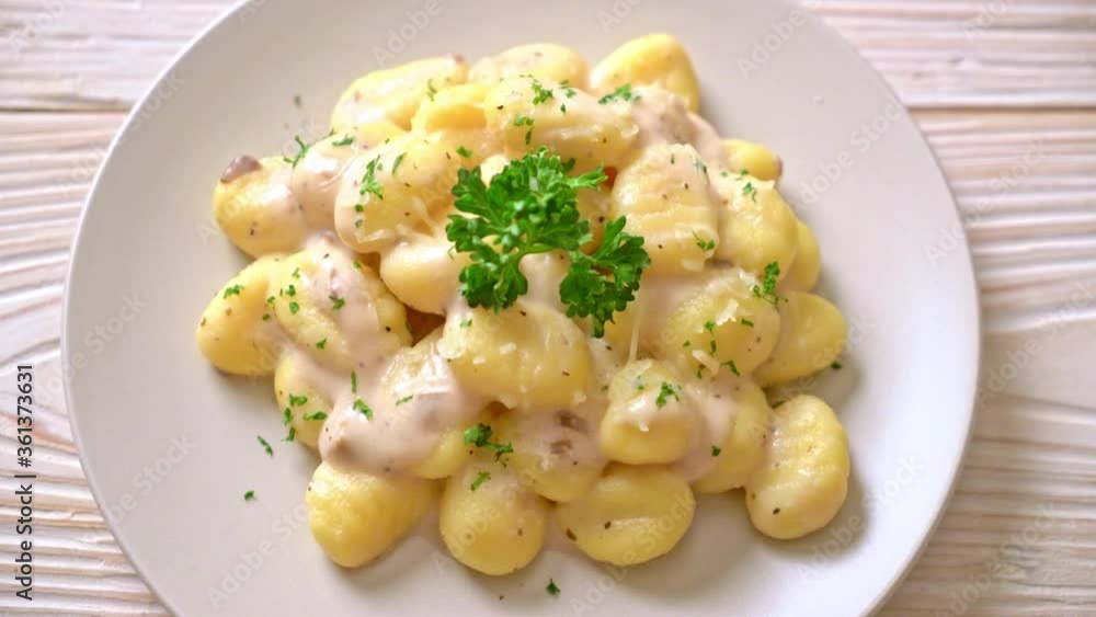 Gnocchi with mushroom cream sauce and cheese - Italian food style Gnocchi with mushroom cream sauce and cheese - Italian food style