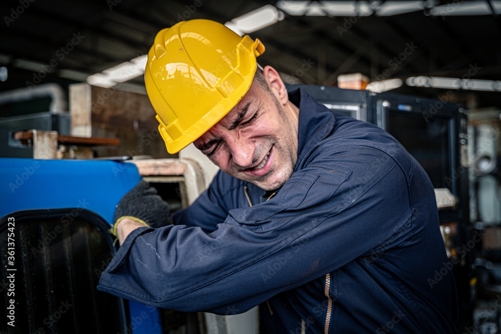 Factory worker got his arm stuck in the machine. Workplace accident