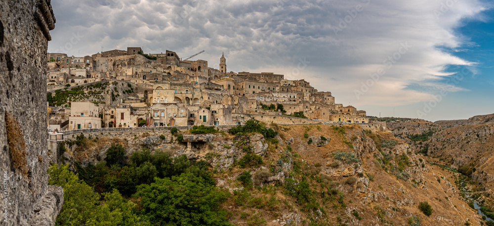 Matera is a city in Italy. The Sassi di Matera, is a complex of cave dwellings carved into the ancient river canyon, often cited as 