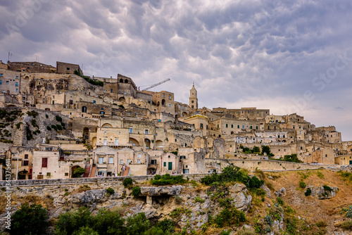 Matera is a city in Italy. The Sassi di Matera, is a complex of cave dwellings carved into the ancient river canyon, often cited as "one of the oldest continuously inhabited cities in the world."