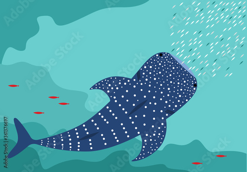 Whale shark and small fishes swimming in the ocean