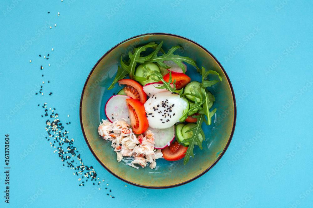 Fresh salad with crab meat, poached egg, cucumbers, tomatoes, radishes, arugula Fresh salad with crab meat, poached egg, cucumbers, tomatoes, radishes, arugula