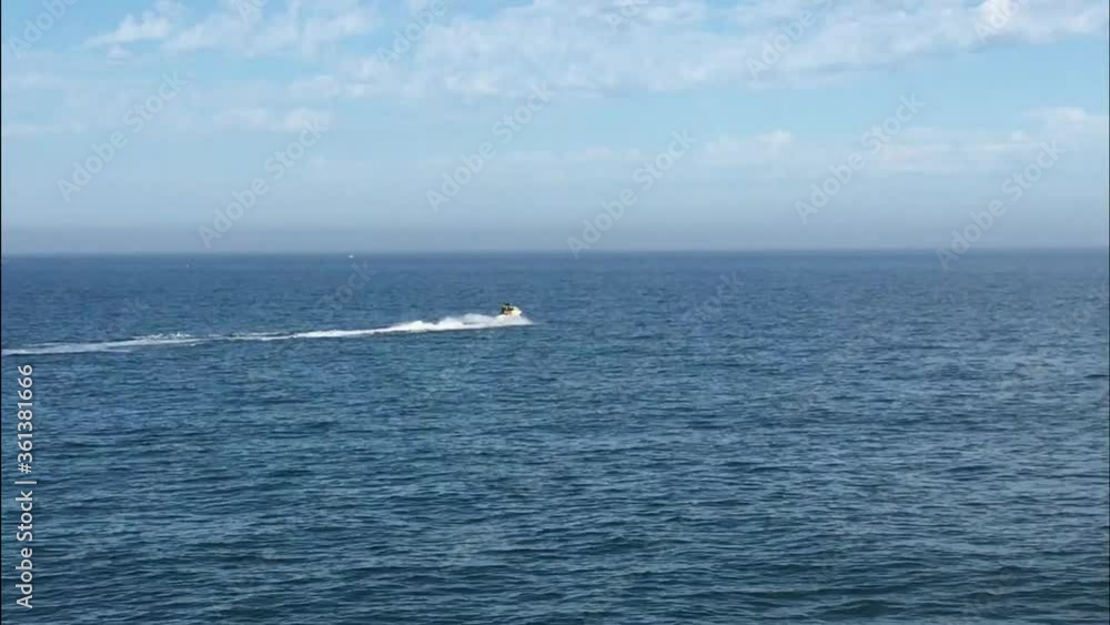 Jet ski by the sea on the coast of Malaga (Andalucia, Spain) Jet ski by the sea on the coast of Malaga (Andalucia, Spain)